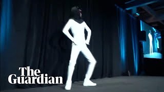 Elon Musk unveils plan for Tesla Bot with man dancing in a bodysuit [upl. by Atiekan]