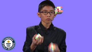 He JUGGLED and SOLVED 3 Rubiks cubes  Guinness World Records [upl. by Yeorgi]